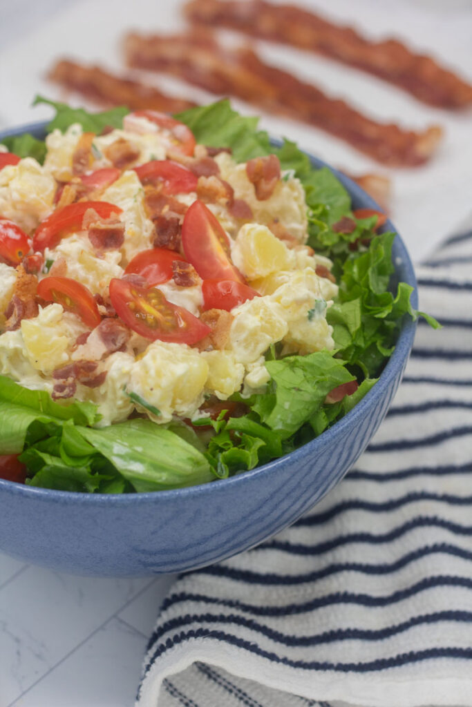 potato salad on top of a bed of lettuce