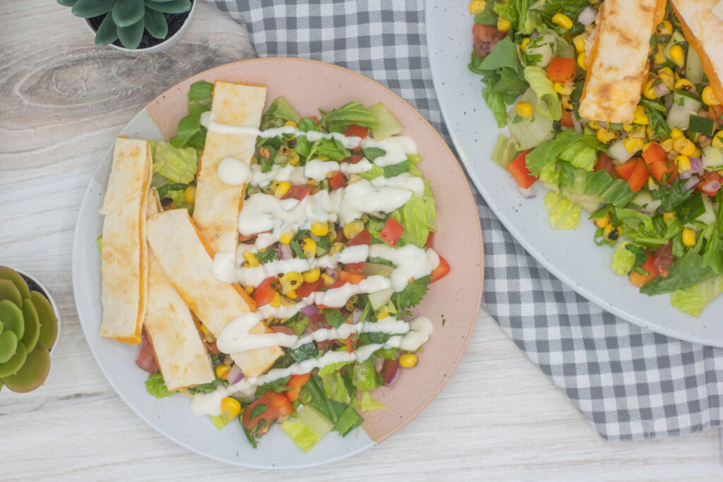 Quesadilla explosion salad topped with ranch dressing