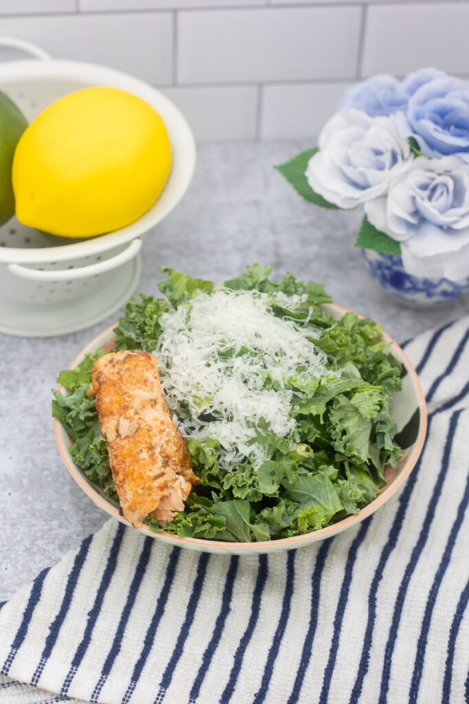 Salmon kale caesar salad with shaved parmesan