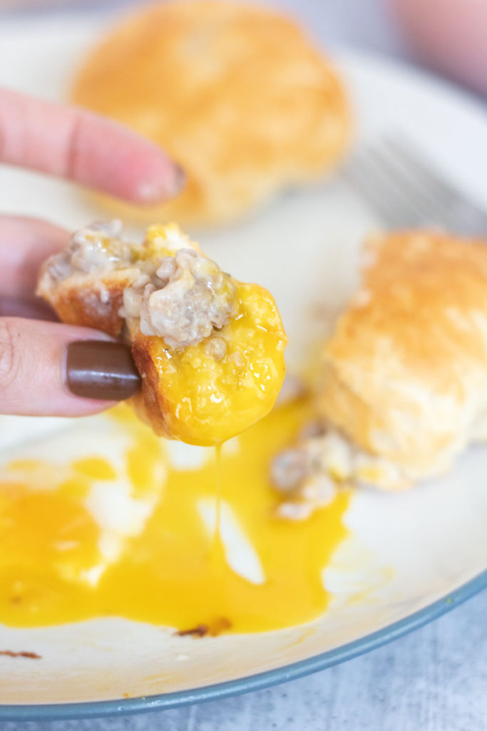 dipping biscuit bombs in runny egg yolk