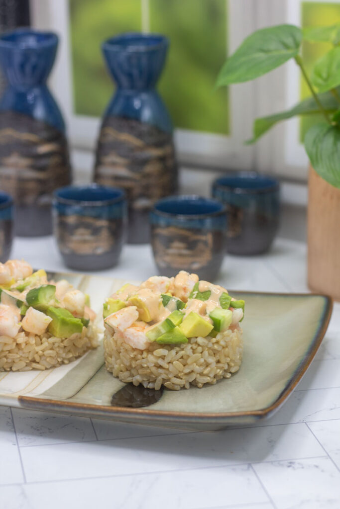 Shrimp stacks with layered rice, shrimp, avocado, and cucumber