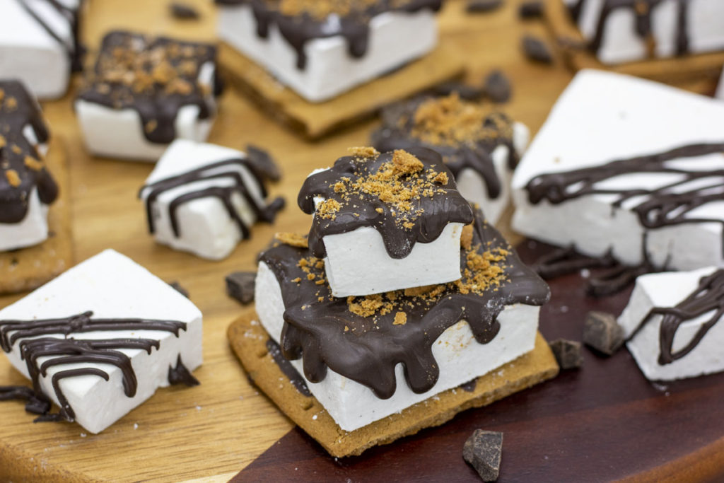 s'mores bites stacked and drizzled vanilla bean marshmallows