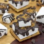 s'mores bites stacked and drizzled vanilla bean marshmallows