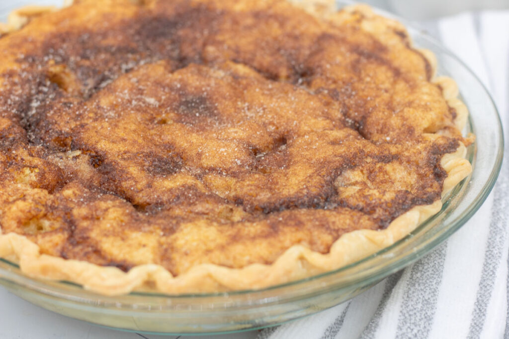 Close up of cracked sugar on snickerdoodle pie