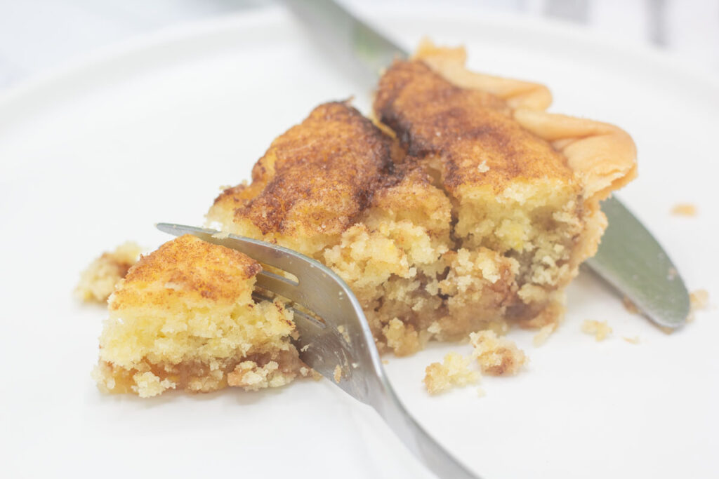 Fork cutting into snickerdoodle pie