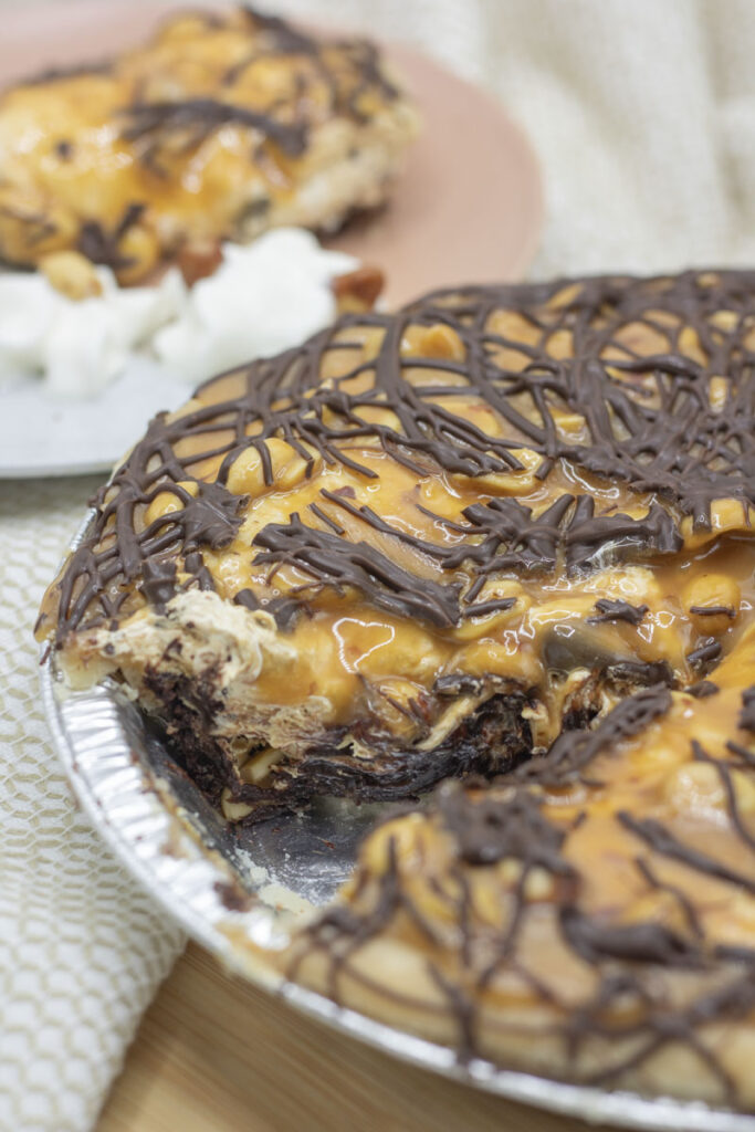 Snickers pie with a slice cut out