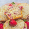 Fresh strawberry cheesecake muffins with a cream cheese layer