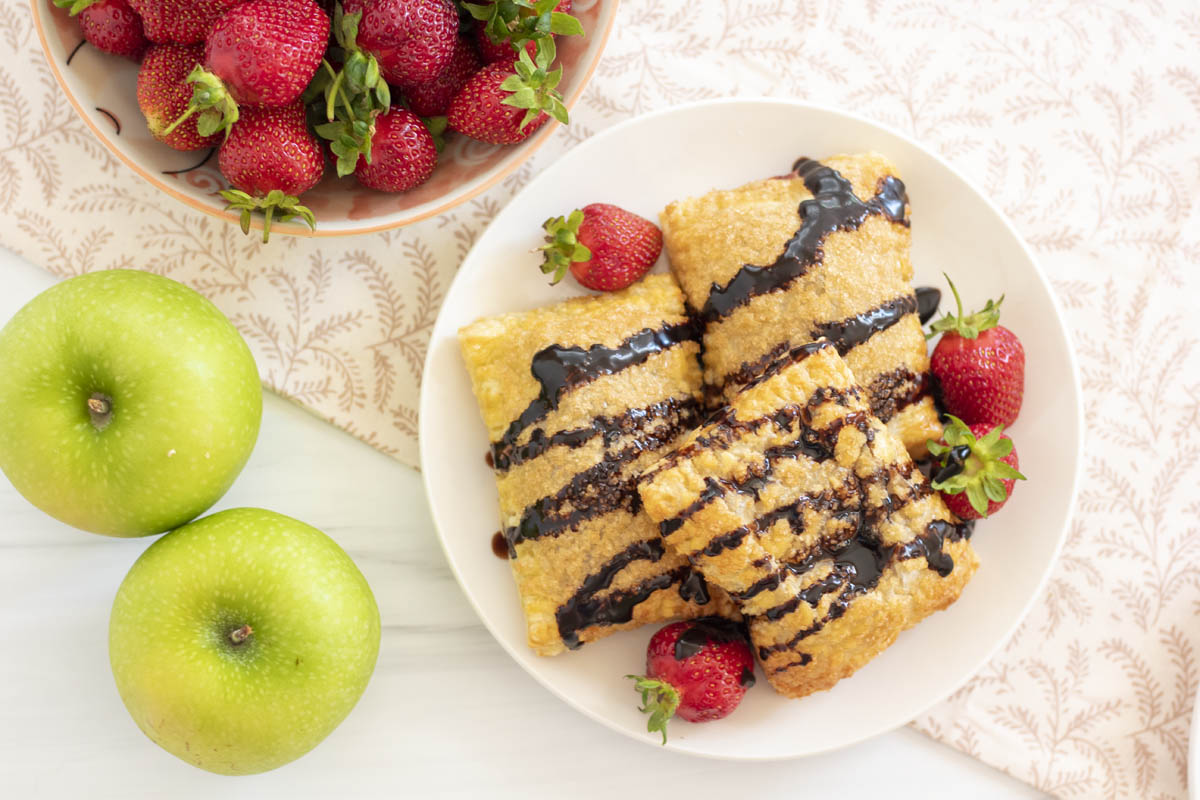 chocolate drizzled strawberry apple hand pies