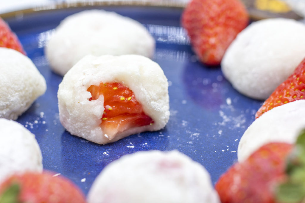 close up of strawberries inside mochi