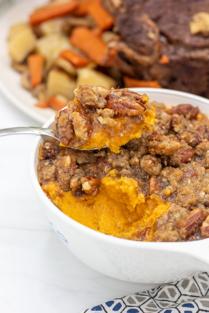 Heaping spoonful of sweet potato souffle