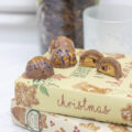 Scattered peanut butter and jelly truffles on christmas books